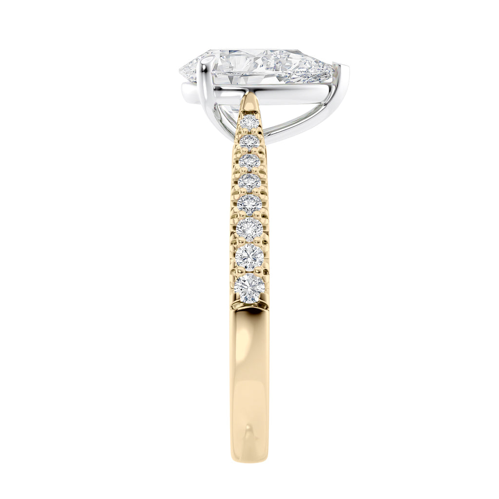 Pear solitaire engagement ring with tapered diamond set gold band end view.