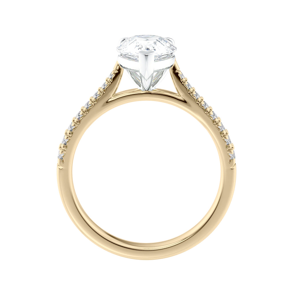Pear solitaire engagement ring with tapered diamond set gold band side view.