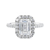 Natural diamond emerald cut halo style engagement ring white gold front view.