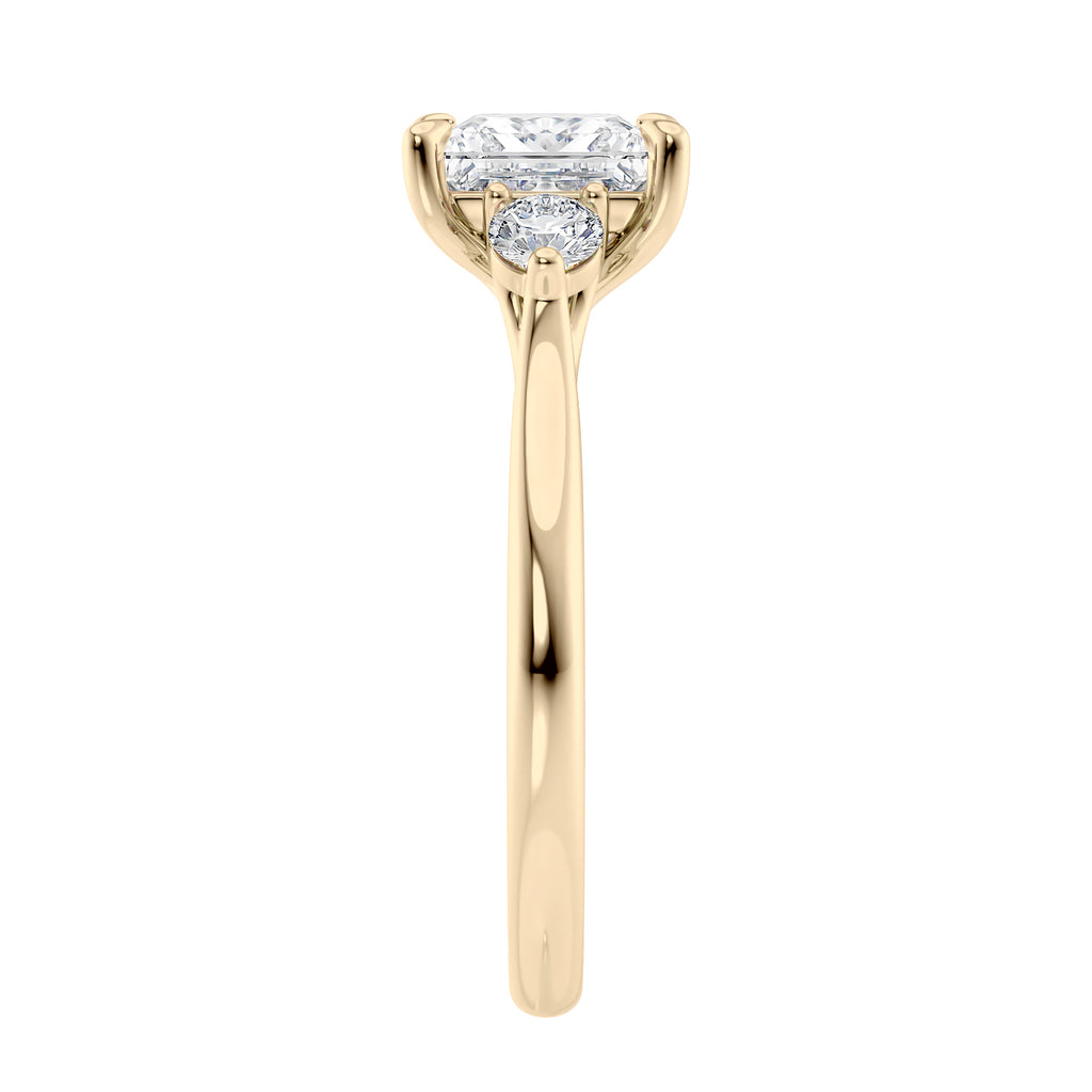 3 stone princess cut diamond engagement ring in gold end view.