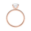Solitaire diamond engagement ring with diamond band 18ct rose gold side view.