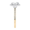 Brilliant cut diamond halo style engagement ring with diamond band gold end view.