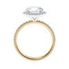 Brilliant cut diamond halo style engagement ring with diamond band gold side view.