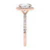 Brilliant cut diamond halo style engagement ring with diamond band rose gold end view.