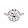 Brilliant cut diamond halo style engagement ring with diamond band rose gold front view.