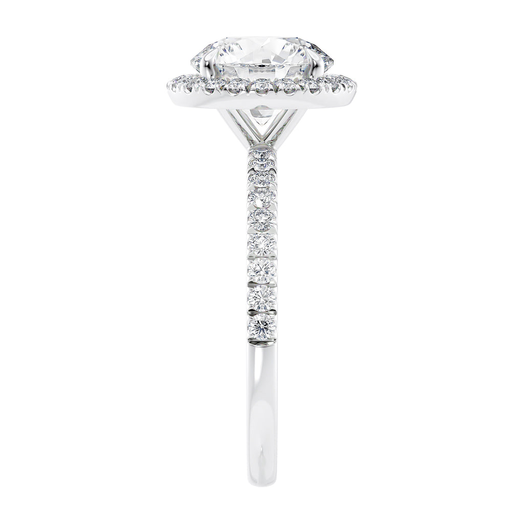 Brilliant cut diamond halo style engagement ring with diamond band white gold end view.