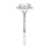 Brilliant cut diamond halo style engagement ring with diamond band white gold end view.