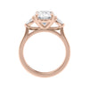3 stone oval and pear diamond engagement ring rose gold side view.
