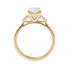 Lab grown oval diamond engagement ring with trilogy diamond set shoulders 18ct gold side view.