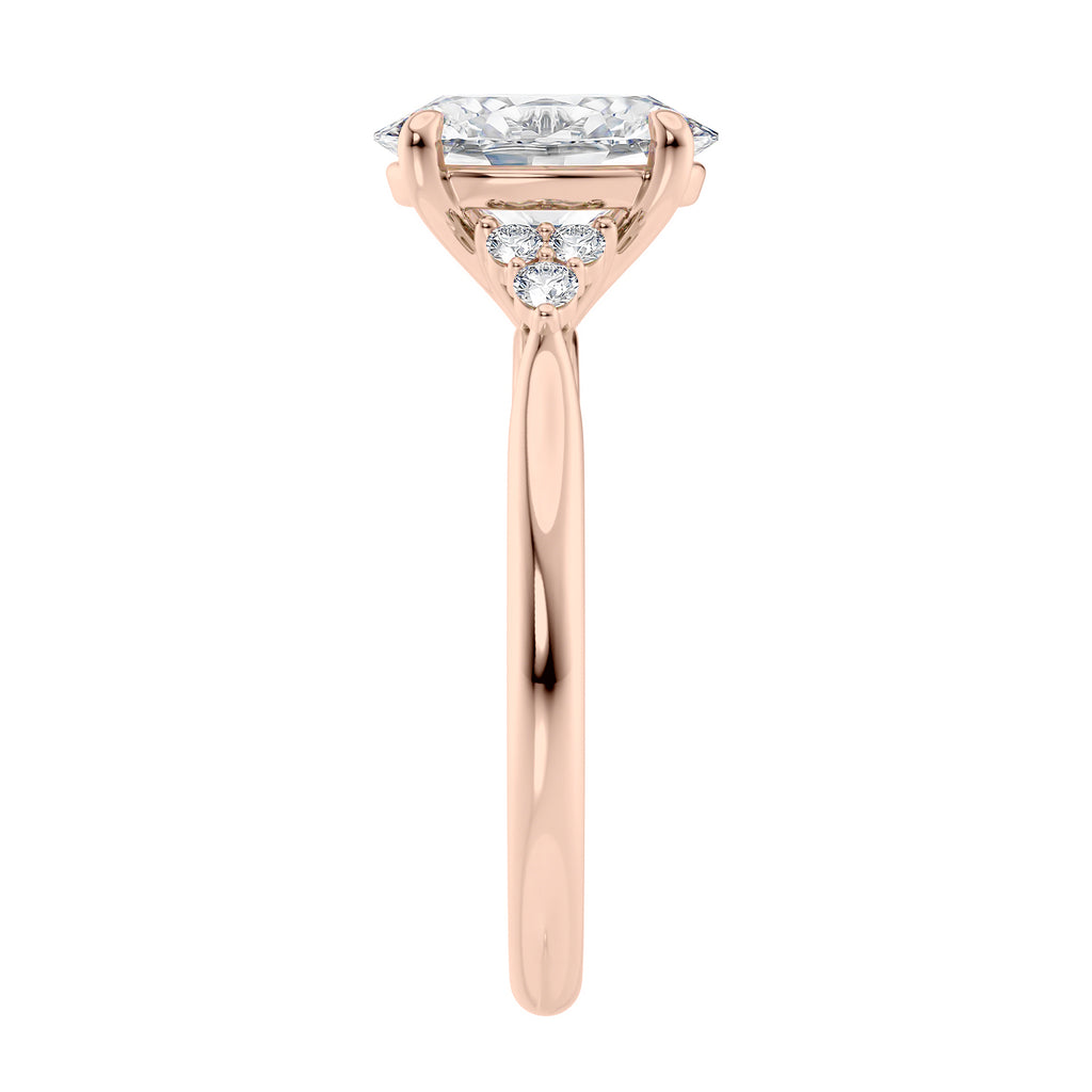 Lab grown oval diamond engagement ring with trilogy diamond set shoulders 18ct rose gold end view.