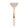 Lab grown oval diamond engagement ring with trilogy diamond set shoulders 18ct rose gold end view.