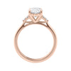 Lab grown oval diamond engagement ring with trilogy diamond set shoulders 18ct rose gold side view.