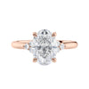 Lab grown oval diamond engagement ring with trilogy diamond set shoulders 18ct rose gold front view.
