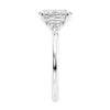 Lab grown oval diamond engagement ring with trilogy diamond set shoulders 18ct white gold end view.
