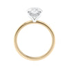 Oval solitaire diamond engagement ring with a hidden halo in gold side view.
