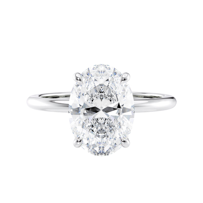 Oval solitaire diamond engagement ring with a hidden halo in white gold front view.