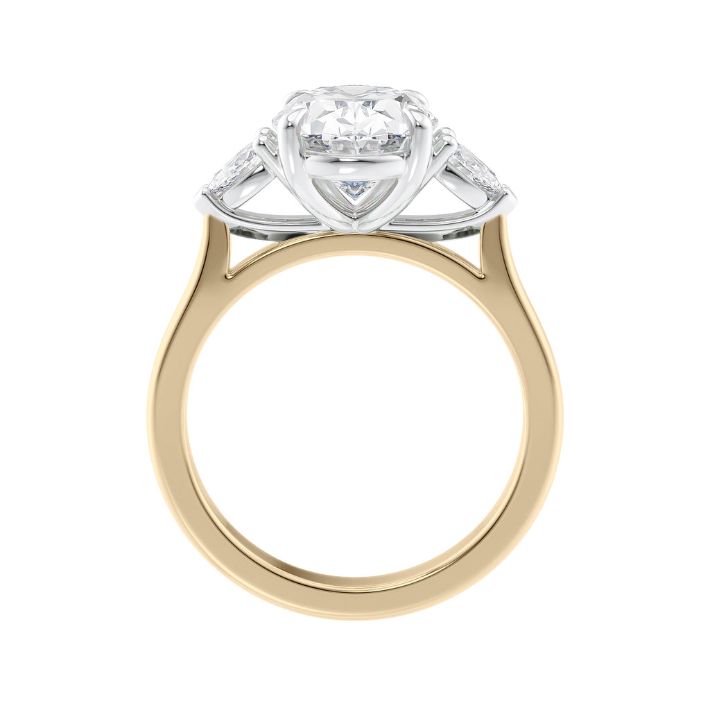 Oval Lab grown diamond three stone engagement ring with pear cut accent stones 18ct gold side view.