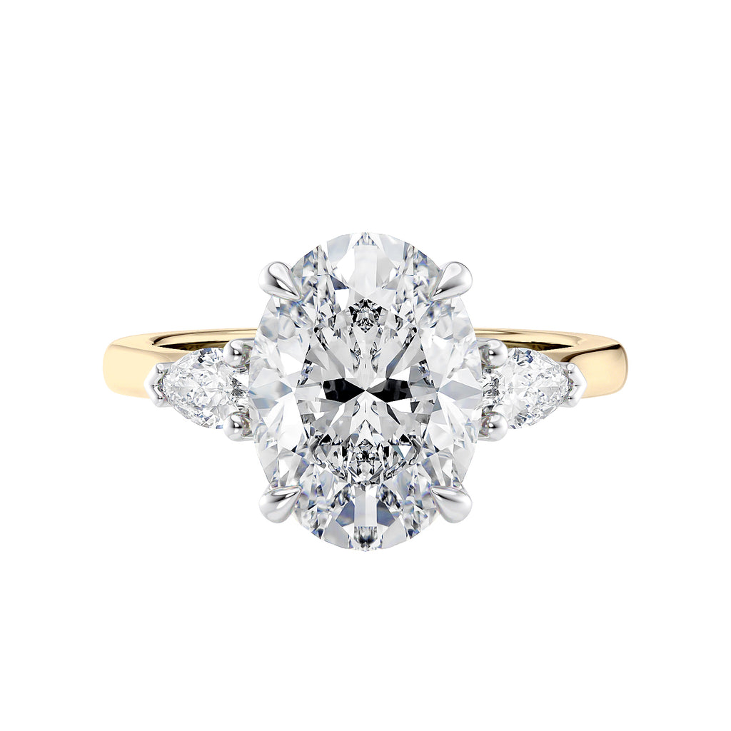 Oval Lab grown diamond three stone engagement ring with pear cut accent stones 18ct gold front view.