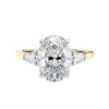 Oval Lab grown diamond three stone engagement ring with pear cut accent stones 18ct gold front view.