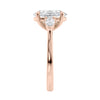 Oval Lab grown diamond three stone engagement ring with pear cut accent stones 18ct rose gold end view.