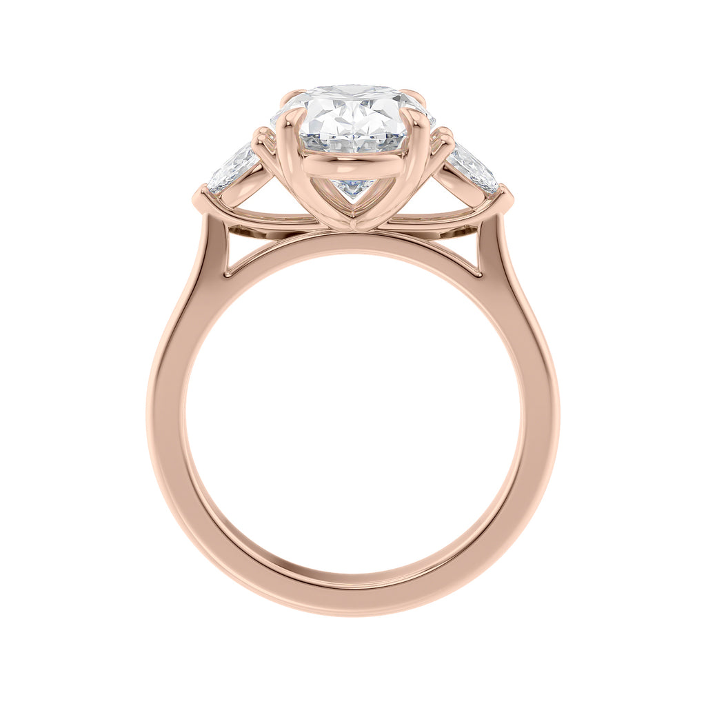 Oval Lab grown diamond three stone engagement ring with pear cut accent stones 18ct rose gold side view.