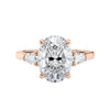 Oval Lab grown diamond three stone engagement ring with pear cut accent stones 18ct rose gold front view.