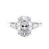 Oval Lab grown diamond three stone engagement ring with pear cut accent stones 18ct white gold front view.