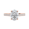 Laboratory grown diamond oval solitaire engagement ring with diamond set band 18ct rose gold front view.