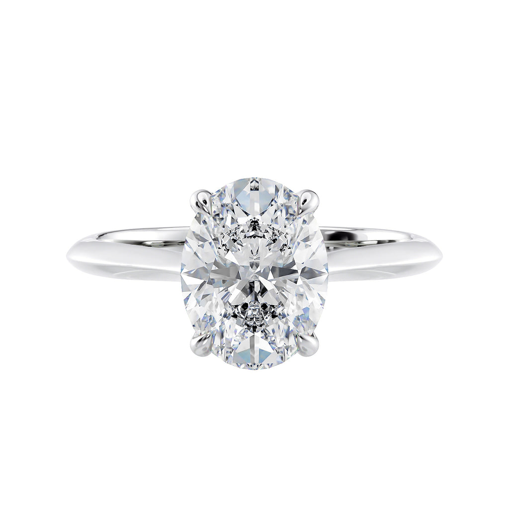 2 carat oval lab grown diamond engagement ring with diamond set bridge white gold front view.