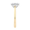 Natural oval hidden diamond bridge engagement ring with gold band end view.