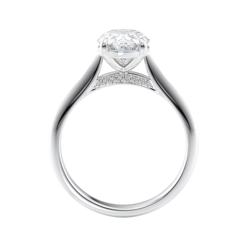 Natural oval hidden diamond bridge engagement ring with white gold band side view.