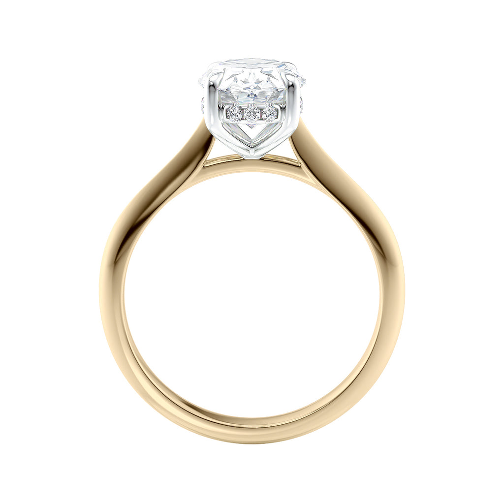 Oval solitaire diamond engagement ring with hidden halo and knife edge shank 18ct gold side view.