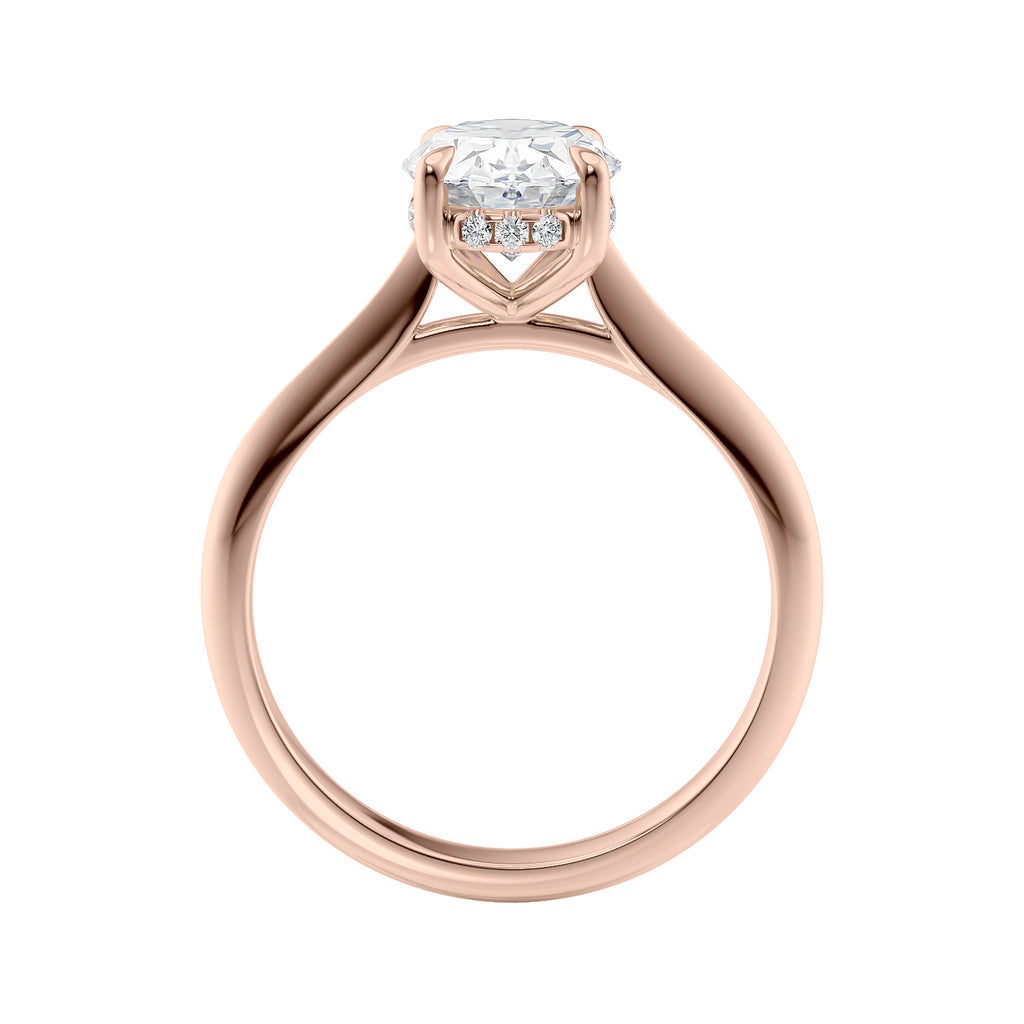 Oval solitaire diamond engagement ring with hidden halo and knife edge shank rose gold side view.
