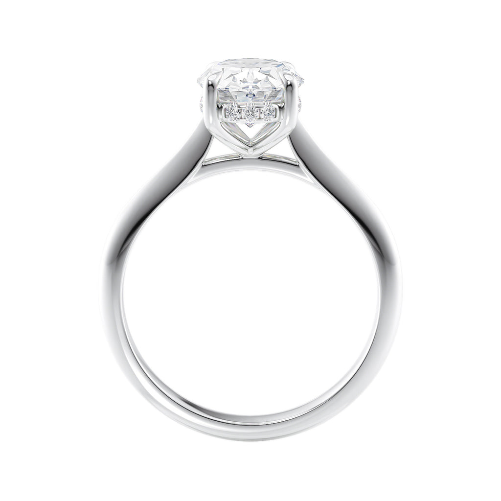 Oval solitaire diamond engagement ring with hidden halo and knife edge shank white gold side view.