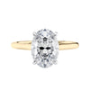 Oval solitaire with ultra slim gold band front view.