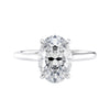 Oval solitaire with ultra slim white gold band front view.