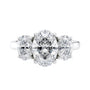 Oval 3 stone diamond engagement ring white gold front view.
