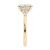 Oval diamond engagement ring with six accent shoulder diamonds 18ct gold end view.