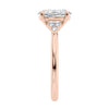 Oval diamond engagement ring with six accent shoulder diamonds rose gold end view.