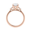 Oval diamond engagement ring with six accent shoulder diamonds rose gold side view.