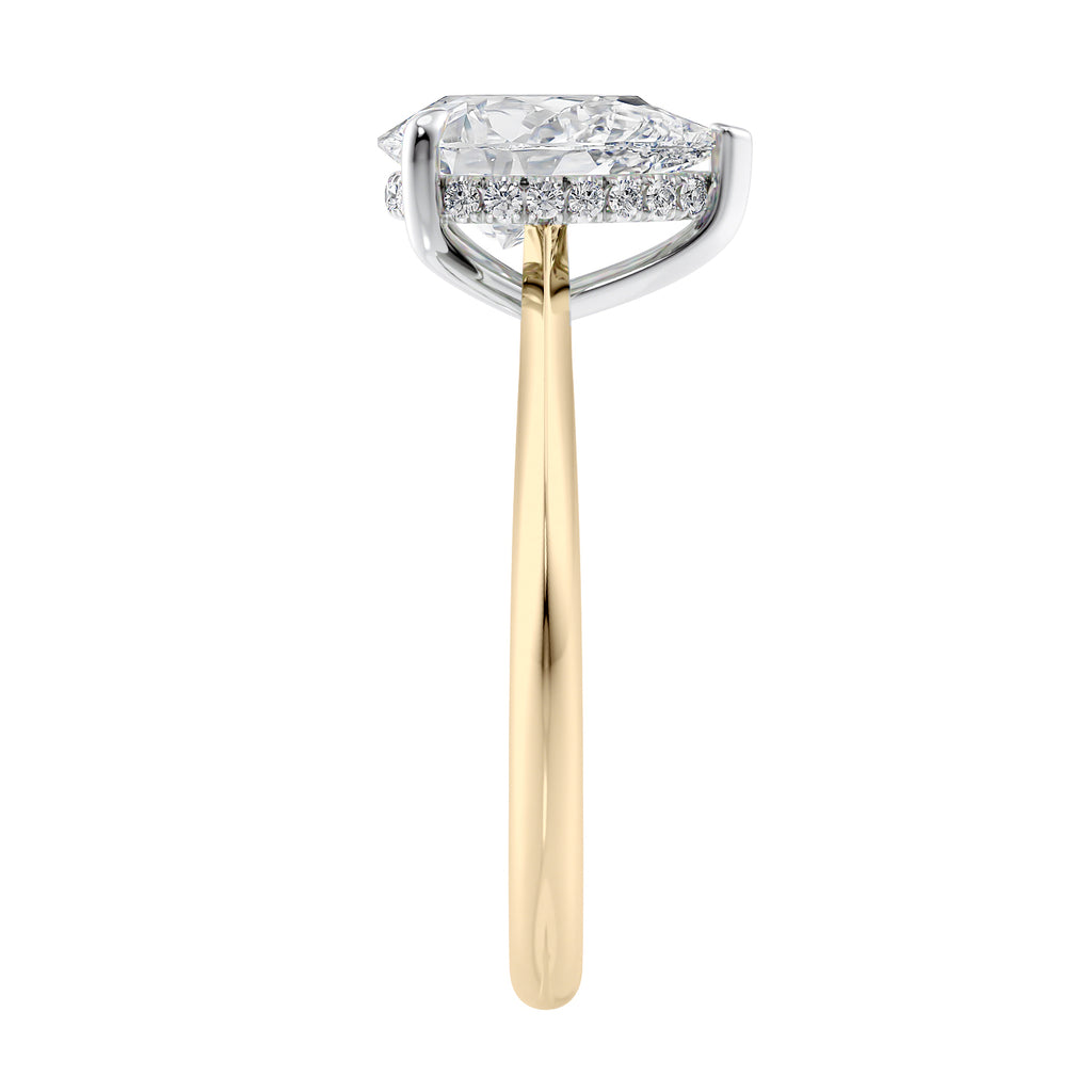 Natural pear cut diamond engagement ring with a hidden halo and 18 gold band end view.