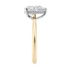 Natural pear cut diamond engagement ring with a hidden halo and 18 gold band end view.