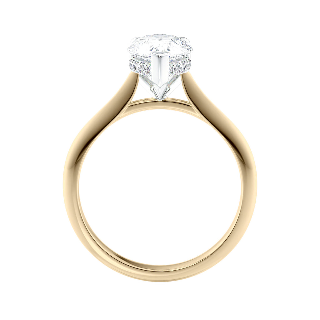 Natural pear cut diamond engagement ring with a hidden halo and 18 gold band side view.