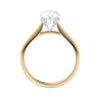 Natural pear cut diamond engagement ring with a hidden halo and 18 gold band side view.