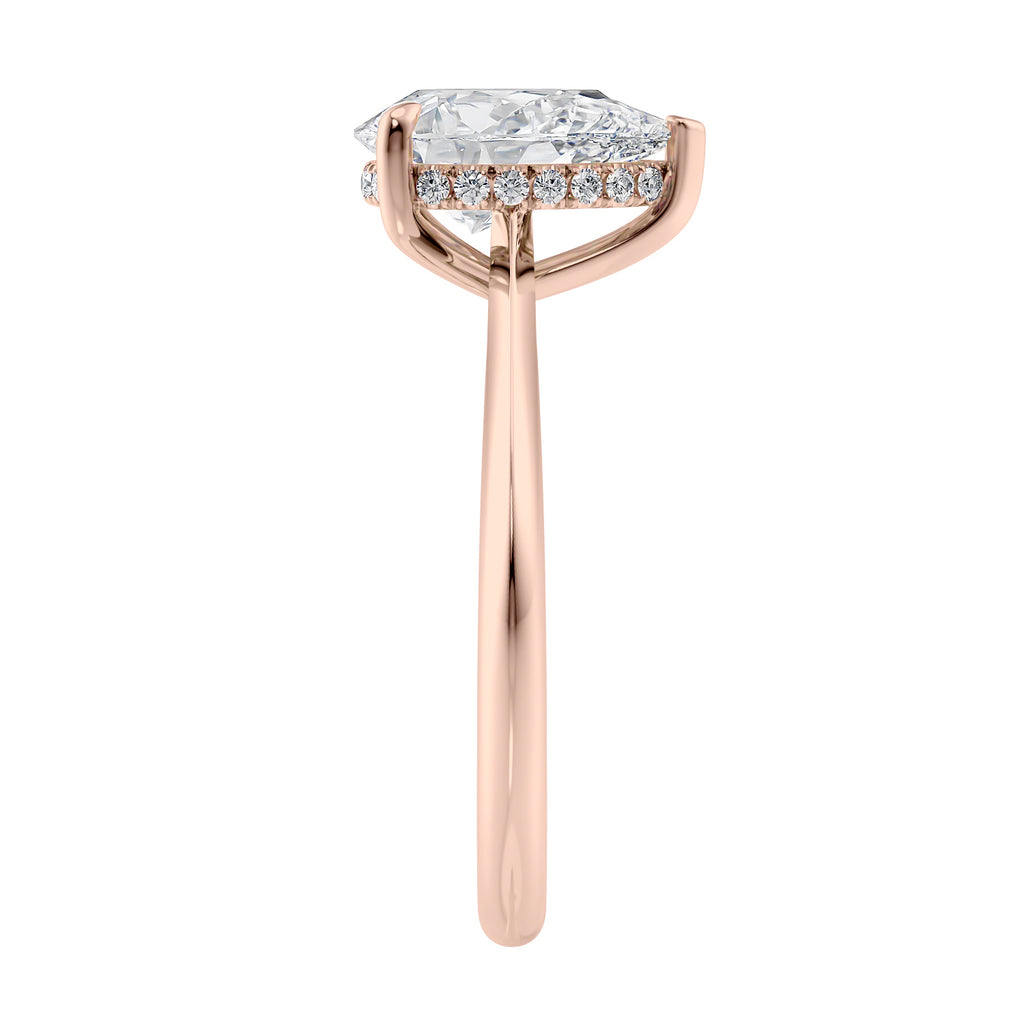 Natural pear cut diamond engagement ring with a hidden halo and 18ct rose gold band end view.