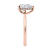 Natural pear cut diamond engagement ring with a hidden halo and 18ct rose gold band end view.