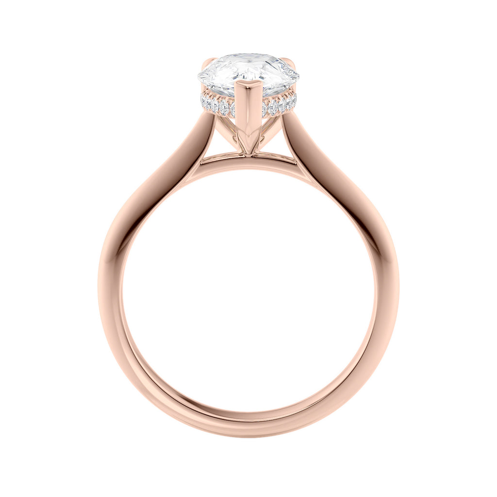 Natural pear cut diamond engagement ring with a hidden halo and 18ct rose gold band side view.