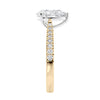 Pear cut lab grown diamond engagement ring with tapered diamond band gold end view.