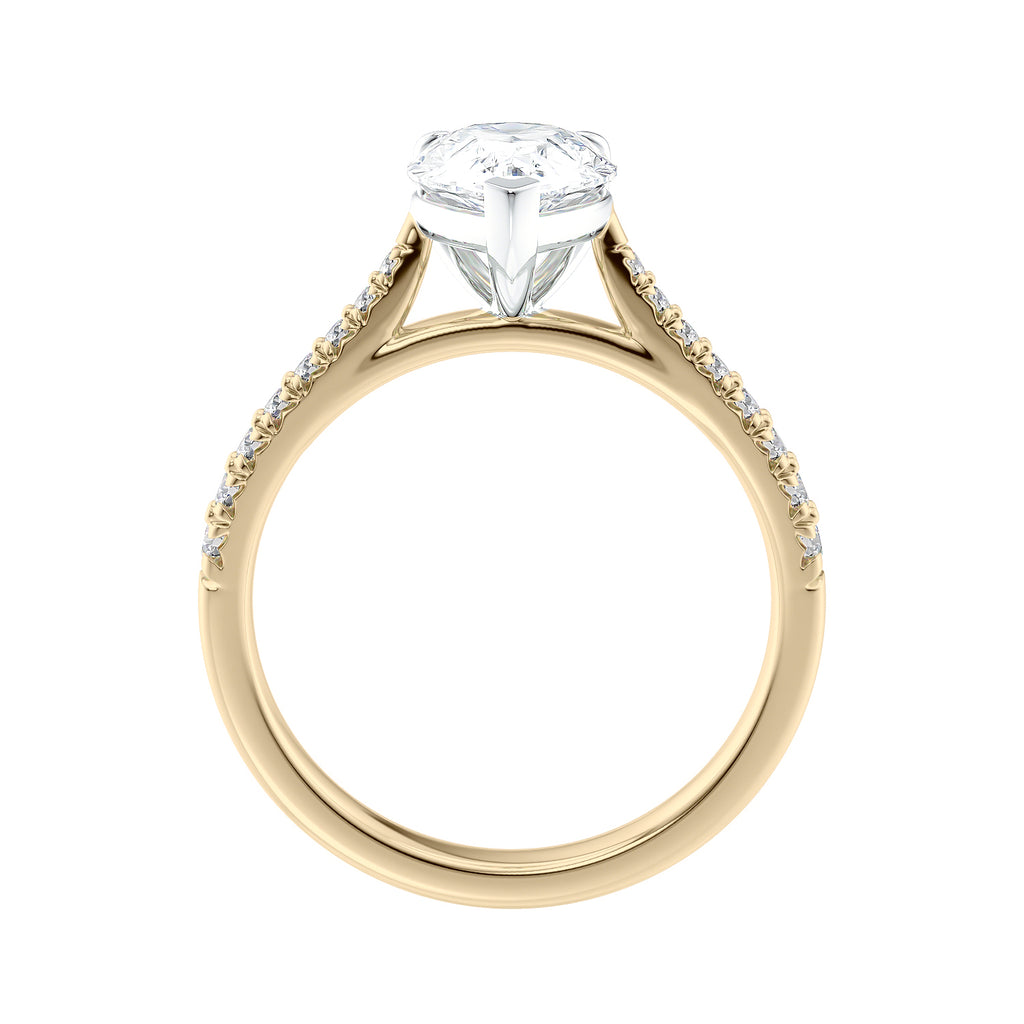 Pear cut lab grown diamond engagement ring with tapered diamond band gold side view.