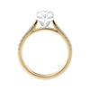 Pear cut lab grown diamond engagement ring with tapered diamond band gold side view.
